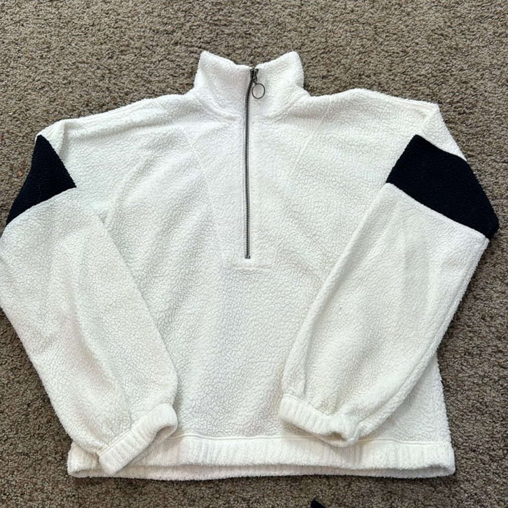 White and black sweater pull over, quarter zip.